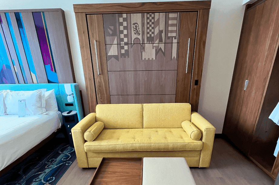 Deluxe Studio VDH yellow couch pictured